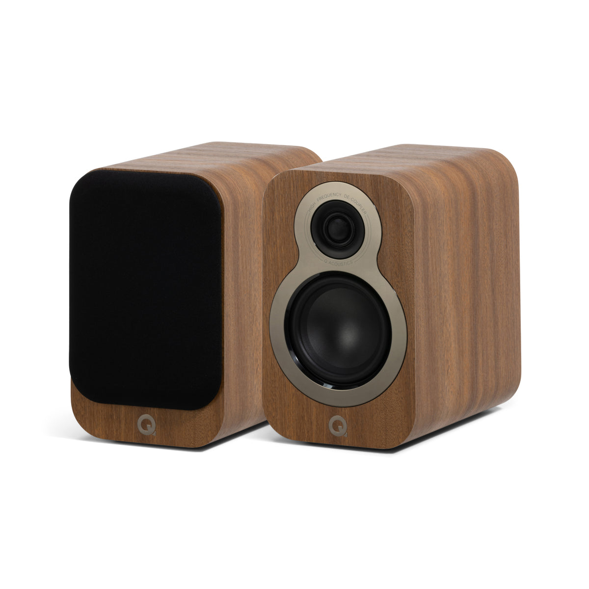 A Oak Q Acoustics 3010c speaker with a silver-colored base and oak speaker grills.